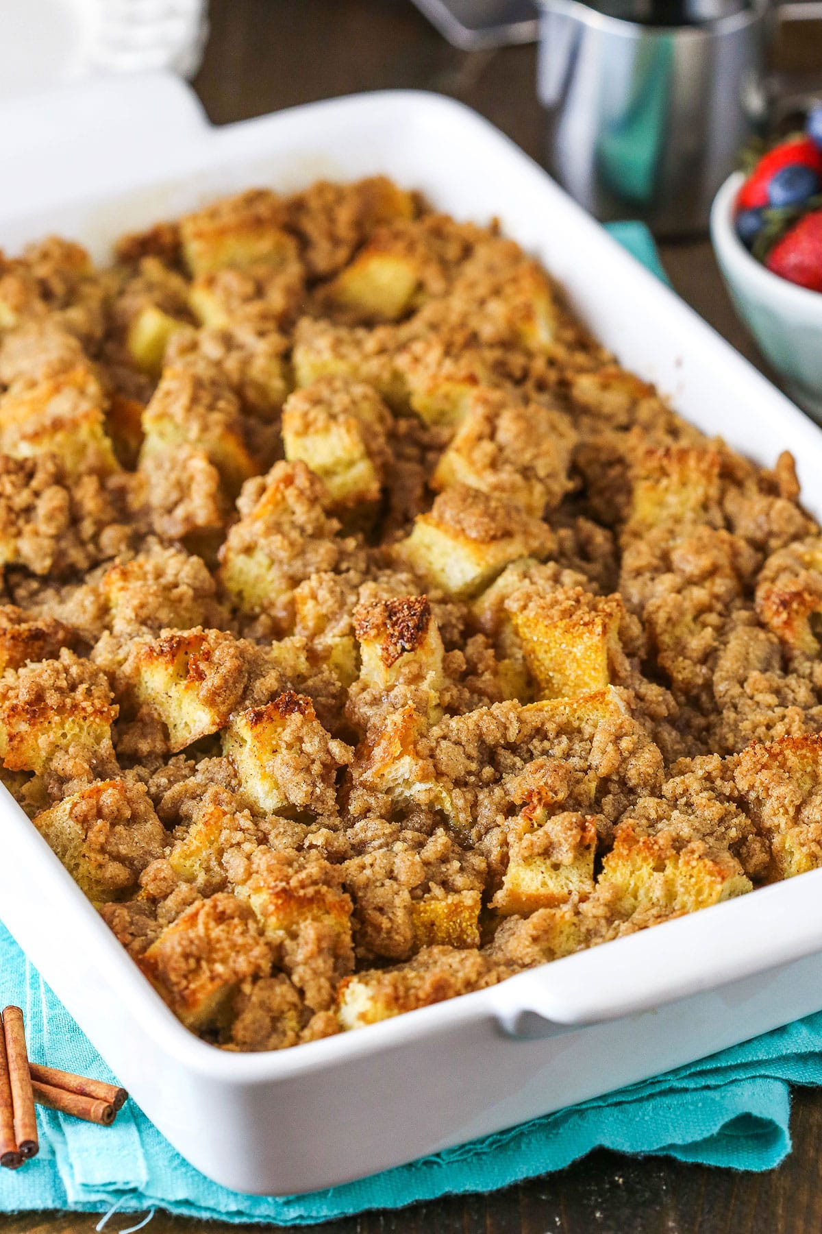 Close up of Overnight Cinnamon French Toast Casserole in a white baking pan