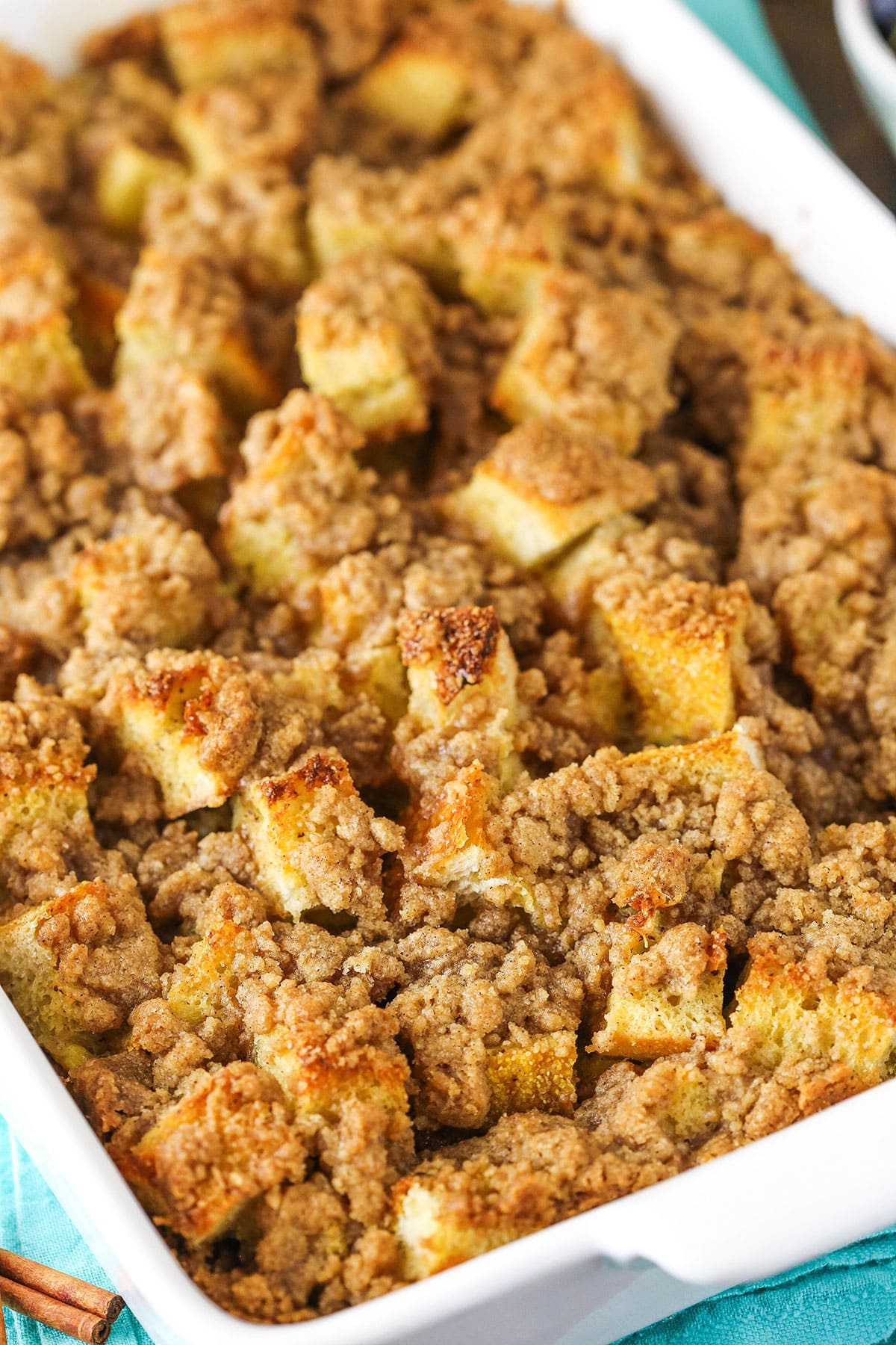 Close up of Overnight Cinnamon French Toast Casserole in a white baking pan