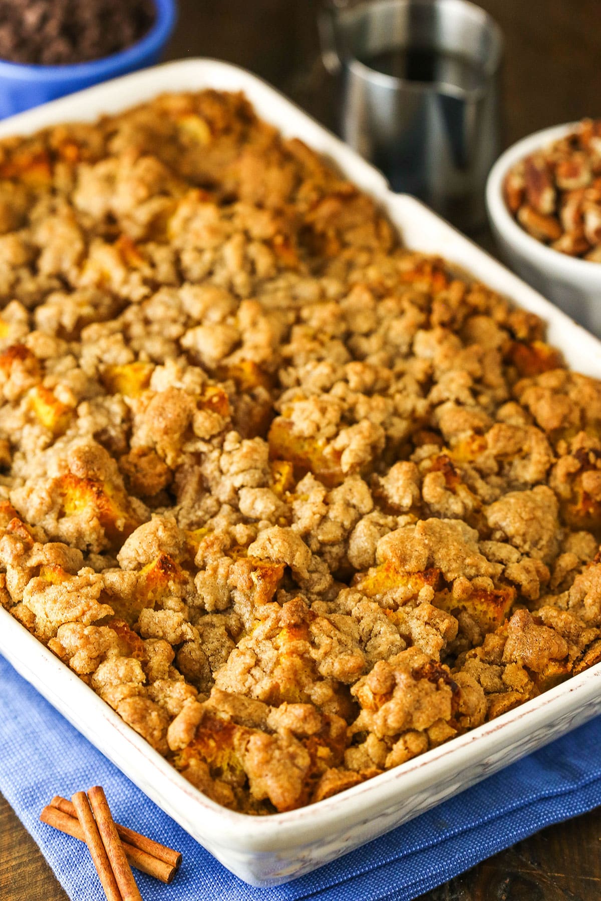 Overhead view of a full Overnight Pumpkin Spice French Toast Casserole in a white platter