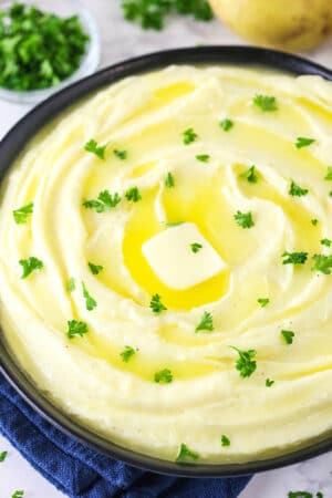 creamy mashed potatoes with parsley on top