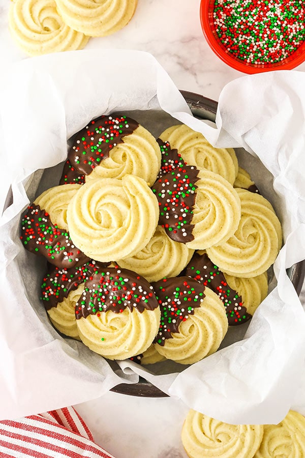 A Tin Filled with Butter Cookies and Lined with Parchment Paper