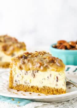 slice of pecan praline cheesecake with another slice in background