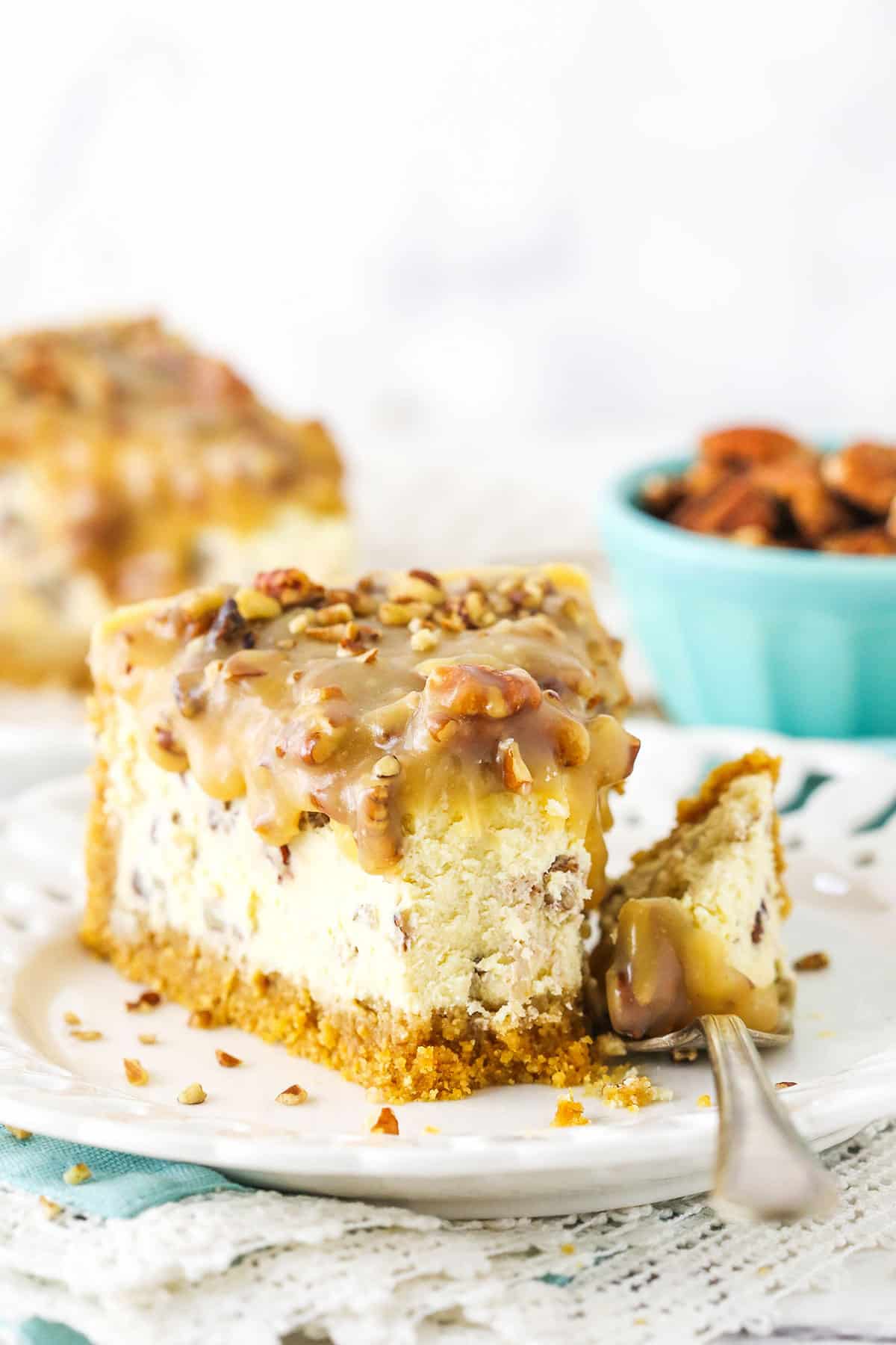 pecan praline cheesecake with a bite taken