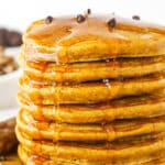 Seven Super Fluffy Pumpkin Pancakes Stacked on a Plate