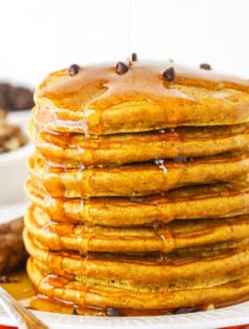 Seven Super Fluffy Pumpkin Pancakes Stacked on a Plate