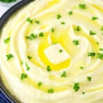 creamy mashed potatoes with parsley on top