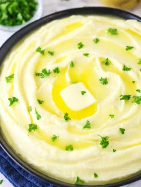 creamy mashed potatoes with parsley on top