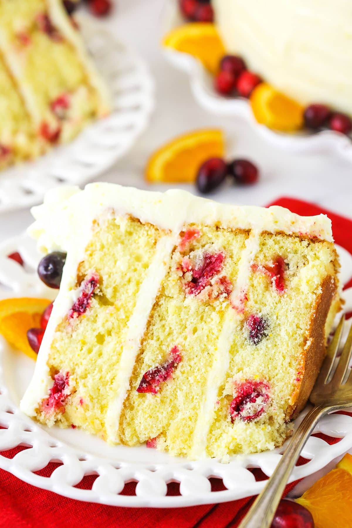 Overhead view of a slice of Cranberry Orange Layer Cake on it's side.