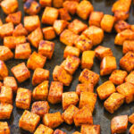 A Pan Full of Roasted Sweet Potatoes with Light Browning