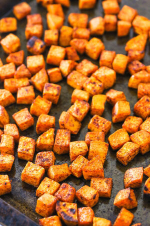 A Pan Full of Roasted Sweet Potatoes with Light Browning