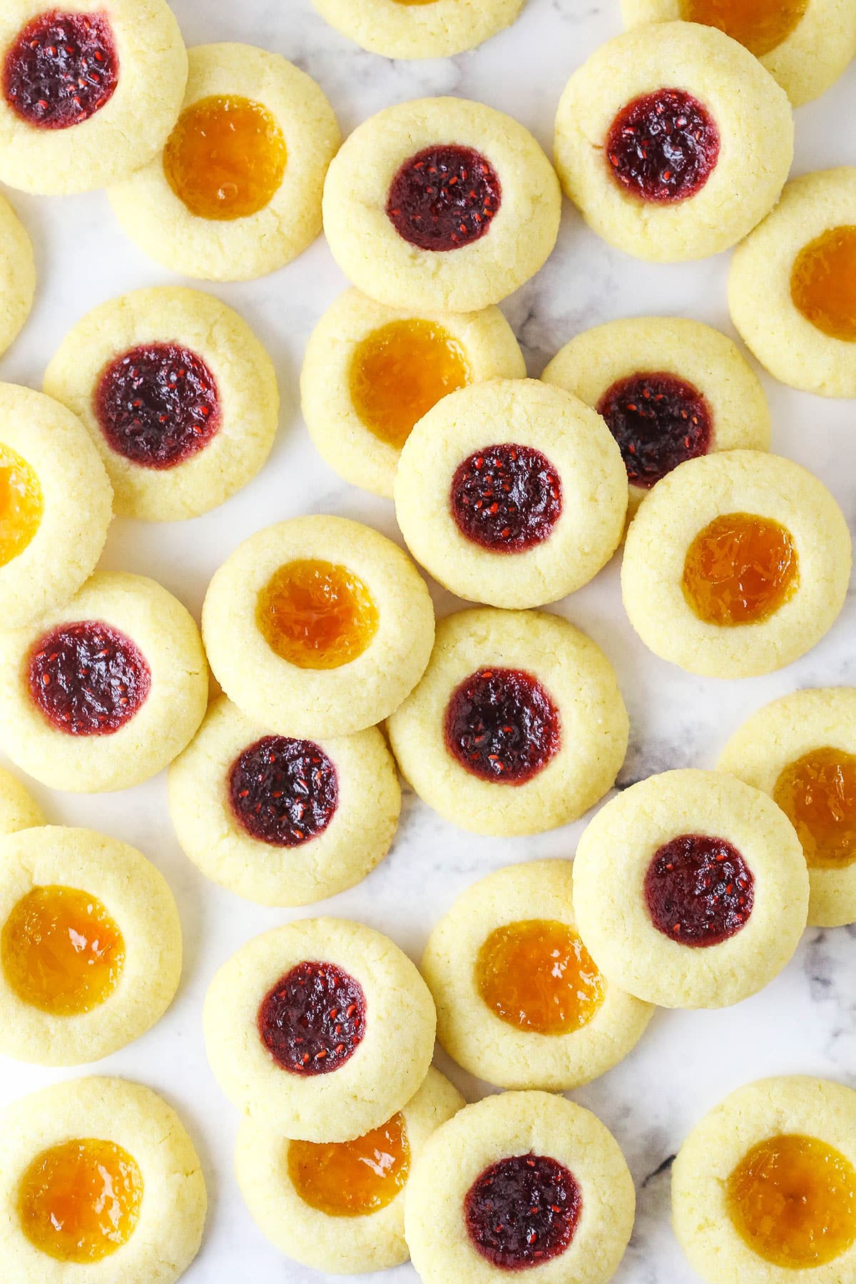Jam-Filled Sugar Cookies on a Marble Counter