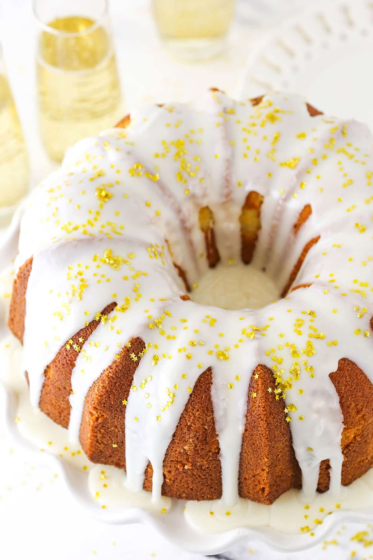 A Champagne Pound Cake Topped with Gold Sprinkles.