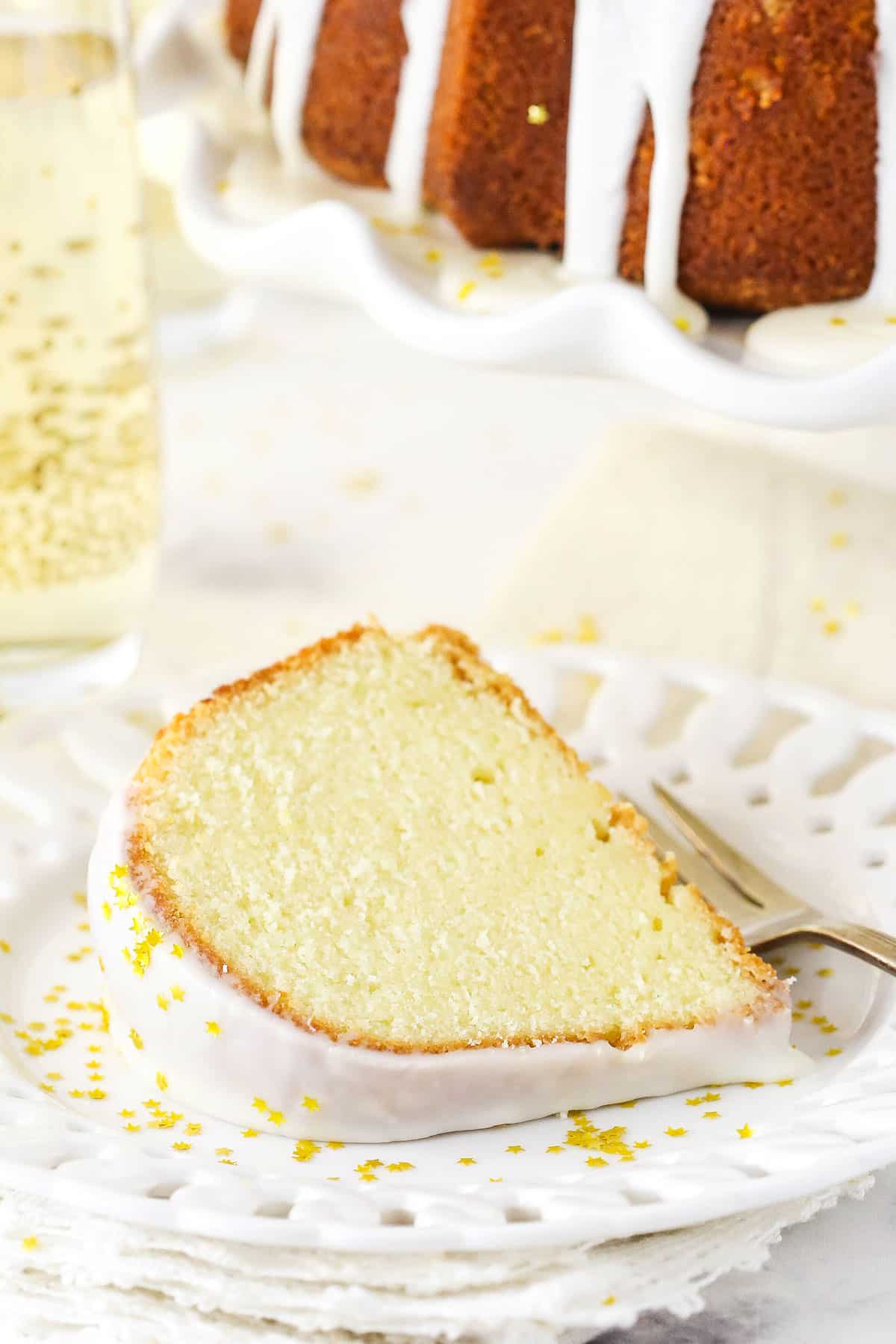 A Slice of Champagne Pound Cake with Star-Shaped Sprinkles on a Plate.