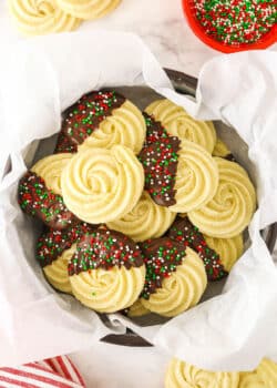 A Tin Filled with Butter Cookies and Lined with Parchment Paper