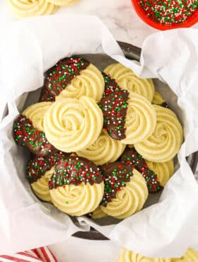 A Tin Filled with Butter Cookies and Lined with Parchment Paper