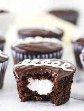 A Bitten Hostess Cupcake with Marshmallow Filling in the Middle