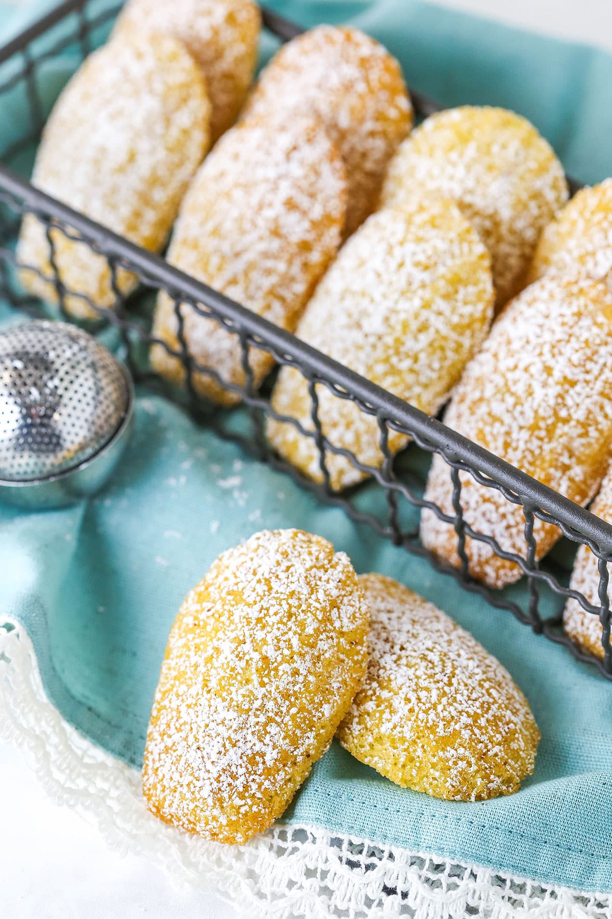 Ten Madeleines on Top of a Decorative Cloth Napkin.