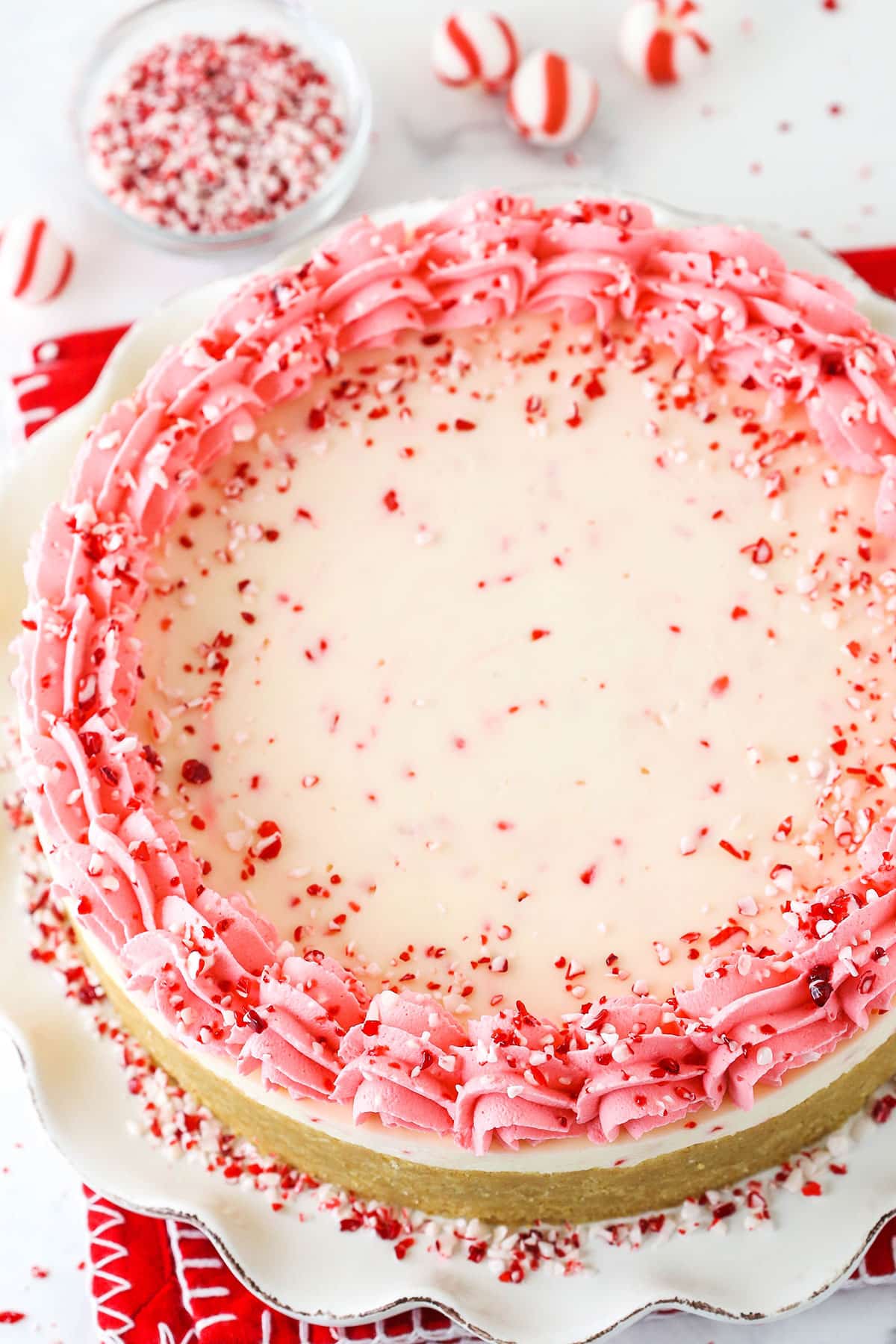 A Decorated Peppermint Cheesecake on a Serving Plate Seen From Above.