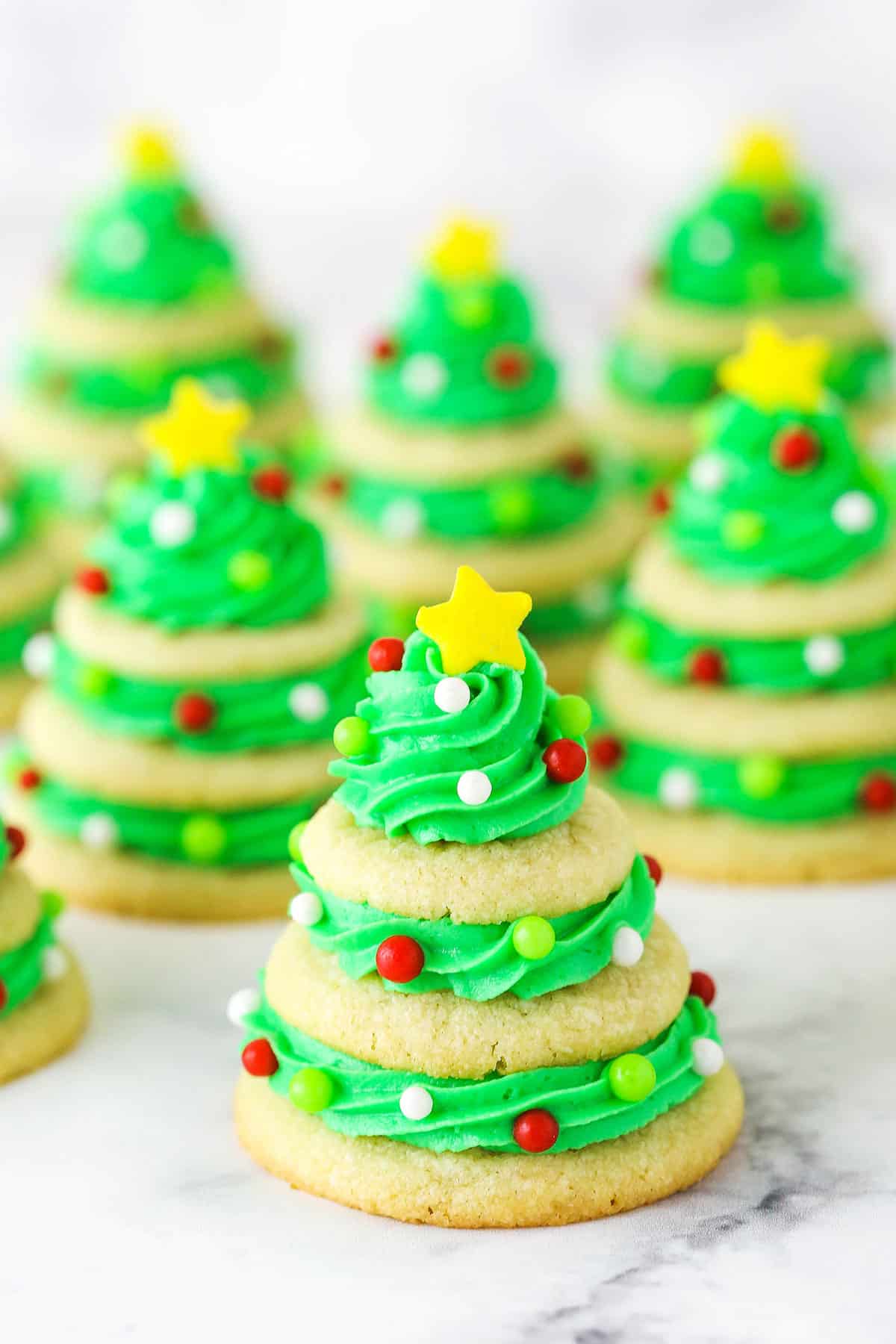 Sugar cookie Christmas trees in rows.