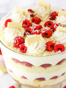 A Three-Layer White Chocolate Raspberry Trifle with Chocolate Shavings on Top