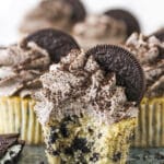 An Oreo Cupcake on a Serving Platter with a Bite Taken Out of It