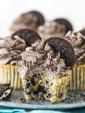 An Oreo Cupcake on a Serving Platter with a Bite Taken Out of It