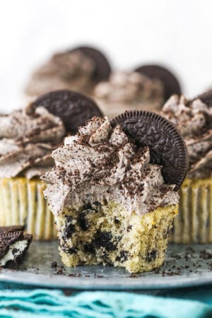 An Oreo Cupcake on a Serving Platter with a Bite Taken Out of It
