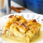 One Serving of Bread Pudding on a White Plate