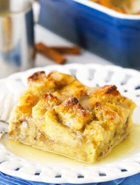 One Serving of Bread Pudding on a White Plate