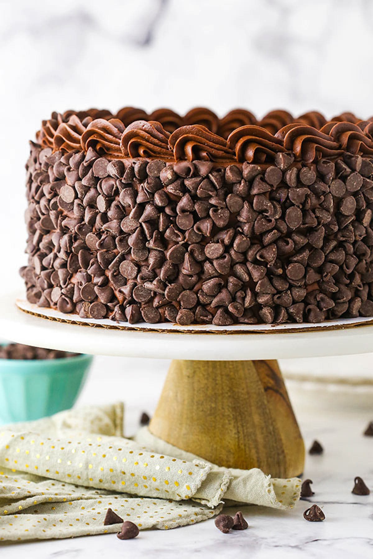 A Chocolate Cheesecake Sitting on Top of a White Cake Stand