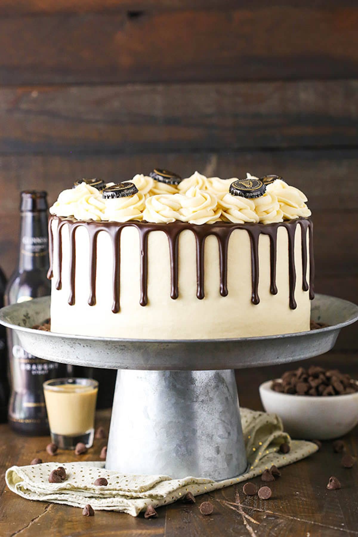 A Metal Cake Stand Holding a Decorated Guinness Chocolate Cake