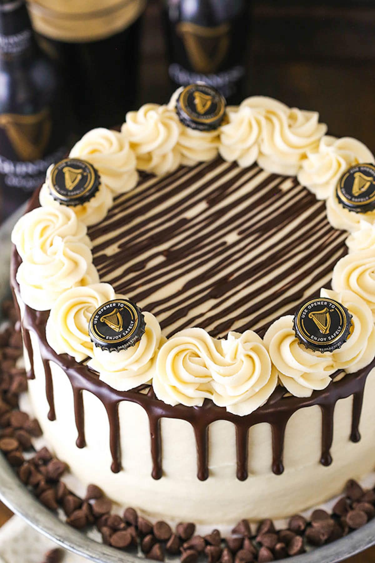 A Guinness Chocolate Layer Cake Decorated with Guinness Bottle Caps