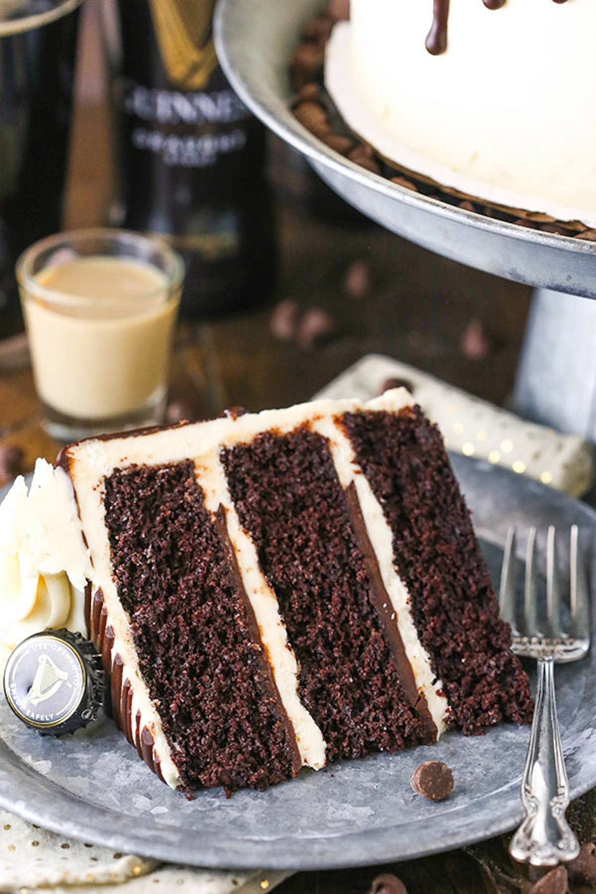 A Piece of Guinness Cake on a Gray Plate with a Fork