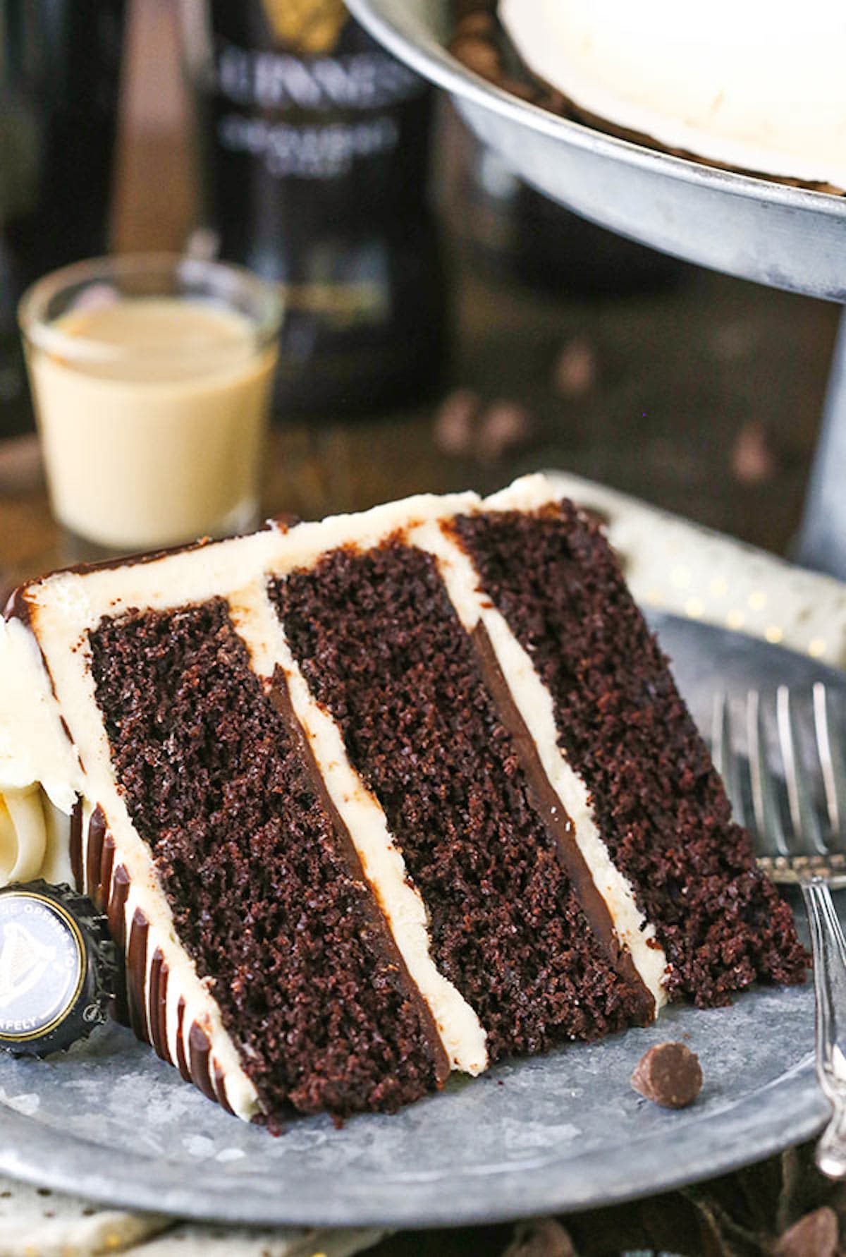 Guinness Chocolate Layer Cake A Slice of Guinness Layer Cake with Baileys Frosting on a Plate