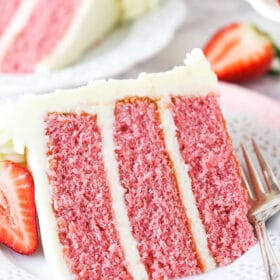 A Slice of Strawberry Cake on a White Dessert Plate
