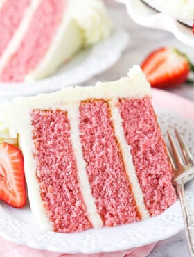 A Slice of Strawberry Cake on a White Dessert Plate