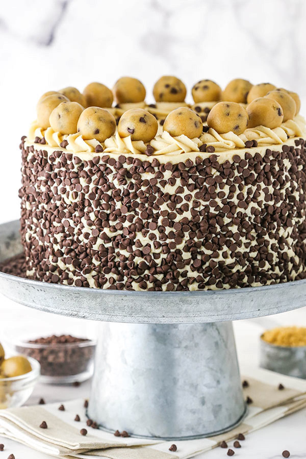 A Chocolate Chip Layer Cake on Top of a Metal Cake Stand