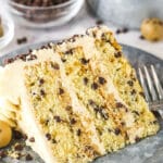 A Piece of Chocolate Chip Cake on a Plate in Front of a Bowl of Mini Chocolate Chips