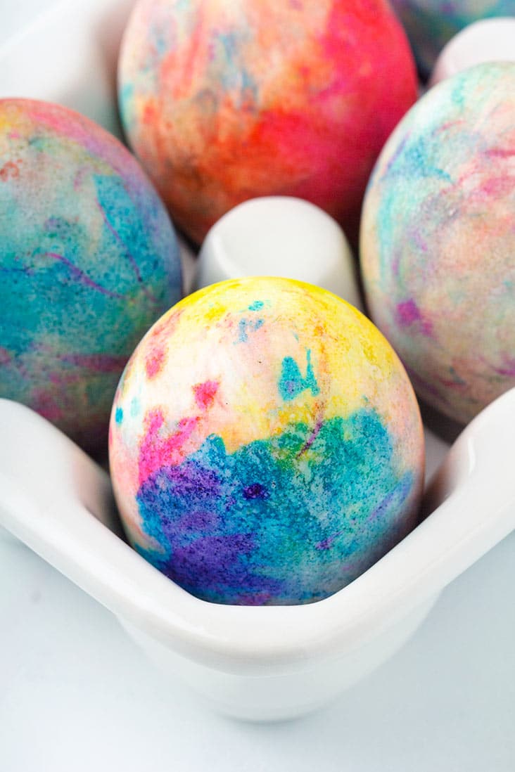 close up of egg in white egg crate