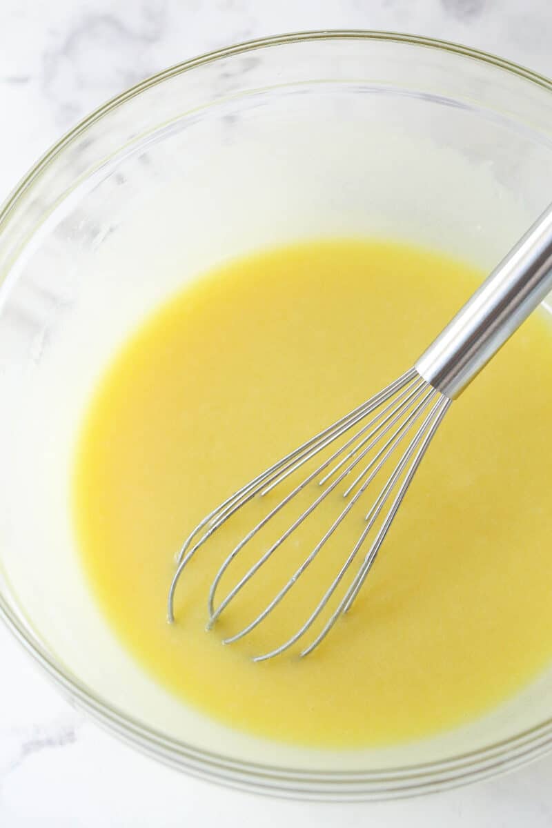 melted butter, sugar and vanilla extract combined in glass bowl
