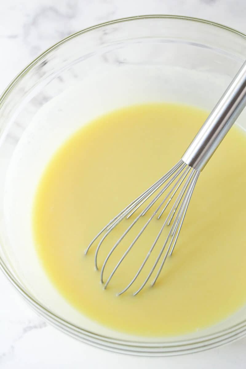 batter with the eggs, sour cream and milk added, in a glass bowl