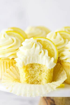 A Frosted Lemon Cupcake with One Bite Taken Out