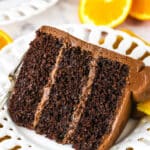 orange chocolate cake slice on a white plate