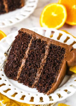 orange chocolate cake slice on a white plate