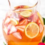 Rosewater Rosé Sangria with slices of strawberries and lemon