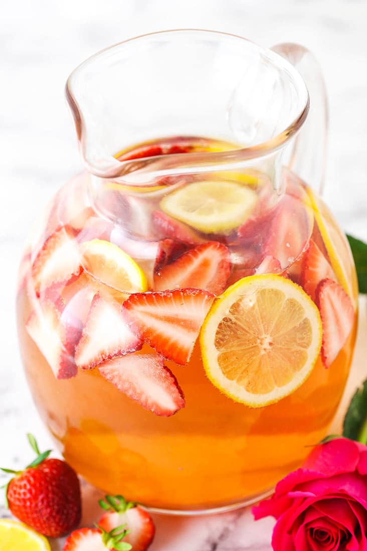 Rosewater Rosé Sangria with slices of strawberries and lemon