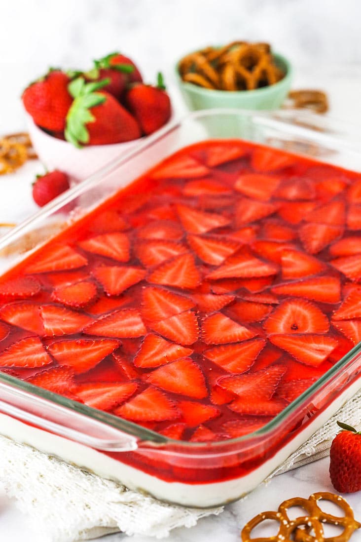 A baking dish of fresh strawberry pretzel salad