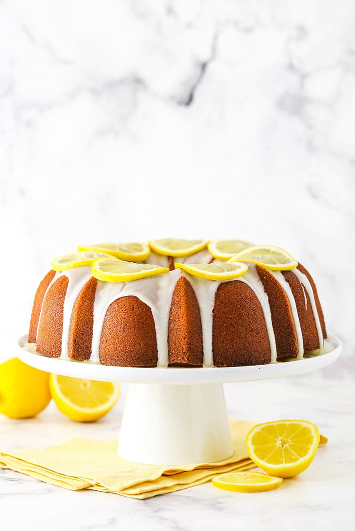 Lemon pound cake with lemon icing drizzle and lemon slices. 