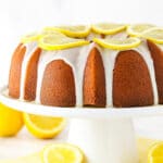 Lemon pound cake with lemon icing on a serving platter.