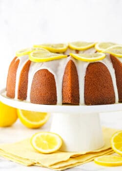 Lemon pound cake with lemon icing on a serving platter.